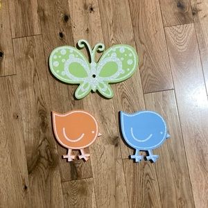 Three wooden wall decorations